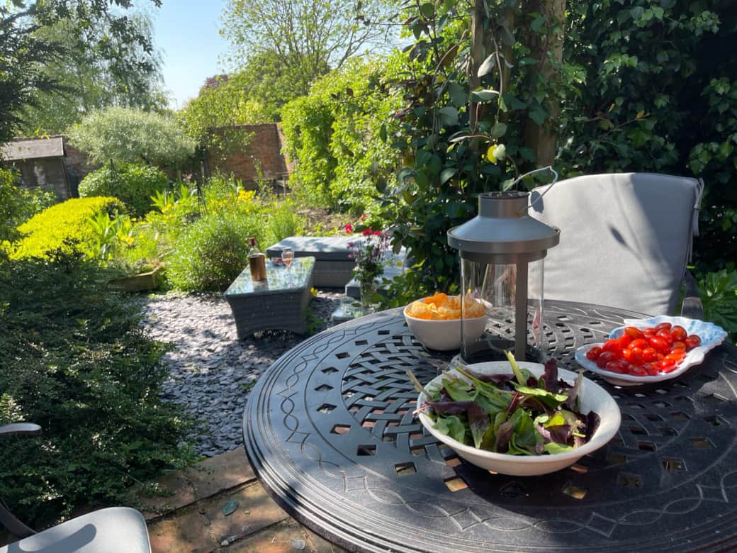 Secret garden patio with pergola and built in BBQ